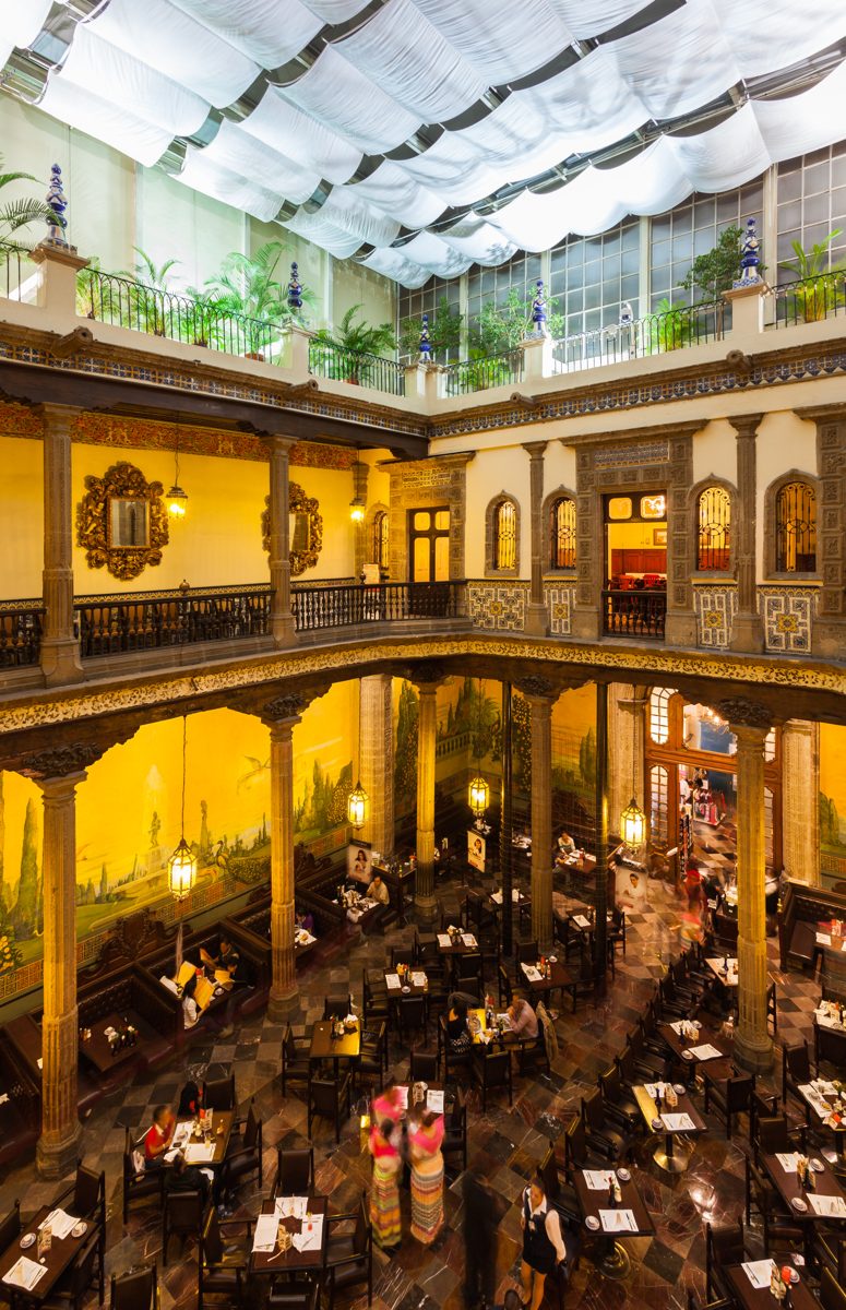 Casa de los Azulejos in Mexico City, showing the blue-and-white tiled facade and corner balconies