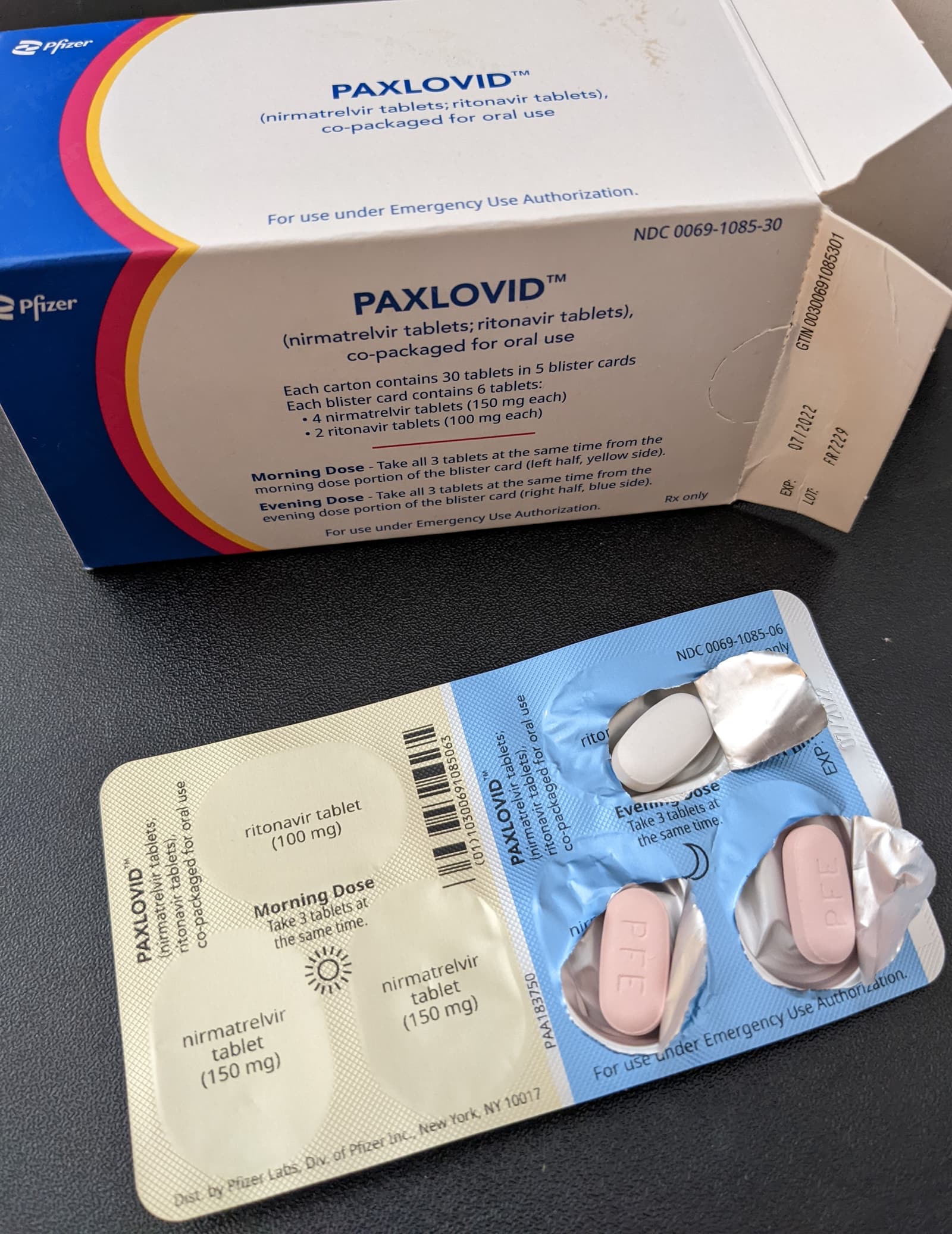 A package of Paxlovid tablets photographed in a clinical-use context.