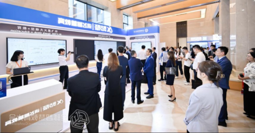 Visitors gather around an iFLYTEK smart-education exhibition booth featuring SPARK Smart Blackboard demonstrations.