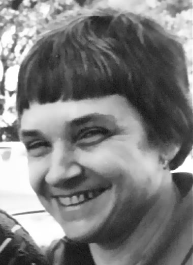 Adrienne Rich in a cropped 1980 portrait photograph, facing slightly to one side.