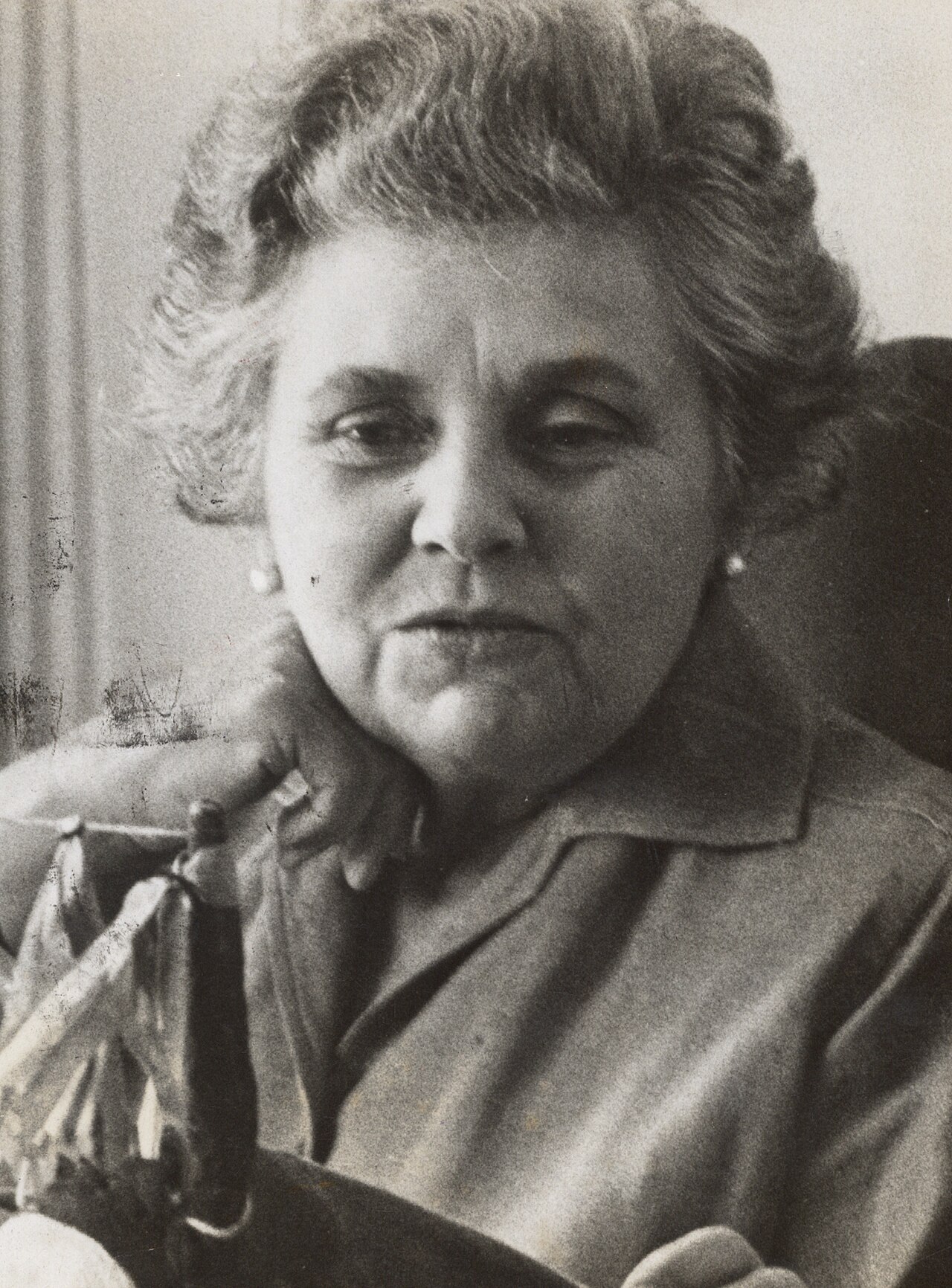 Elizabeth Bishop in a cropped 1964 portrait photograph, turned slightly to one side.