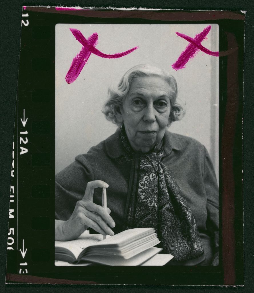 Eudora Welty seated with an open book in a 1980 Library of Congress portrait photograph.