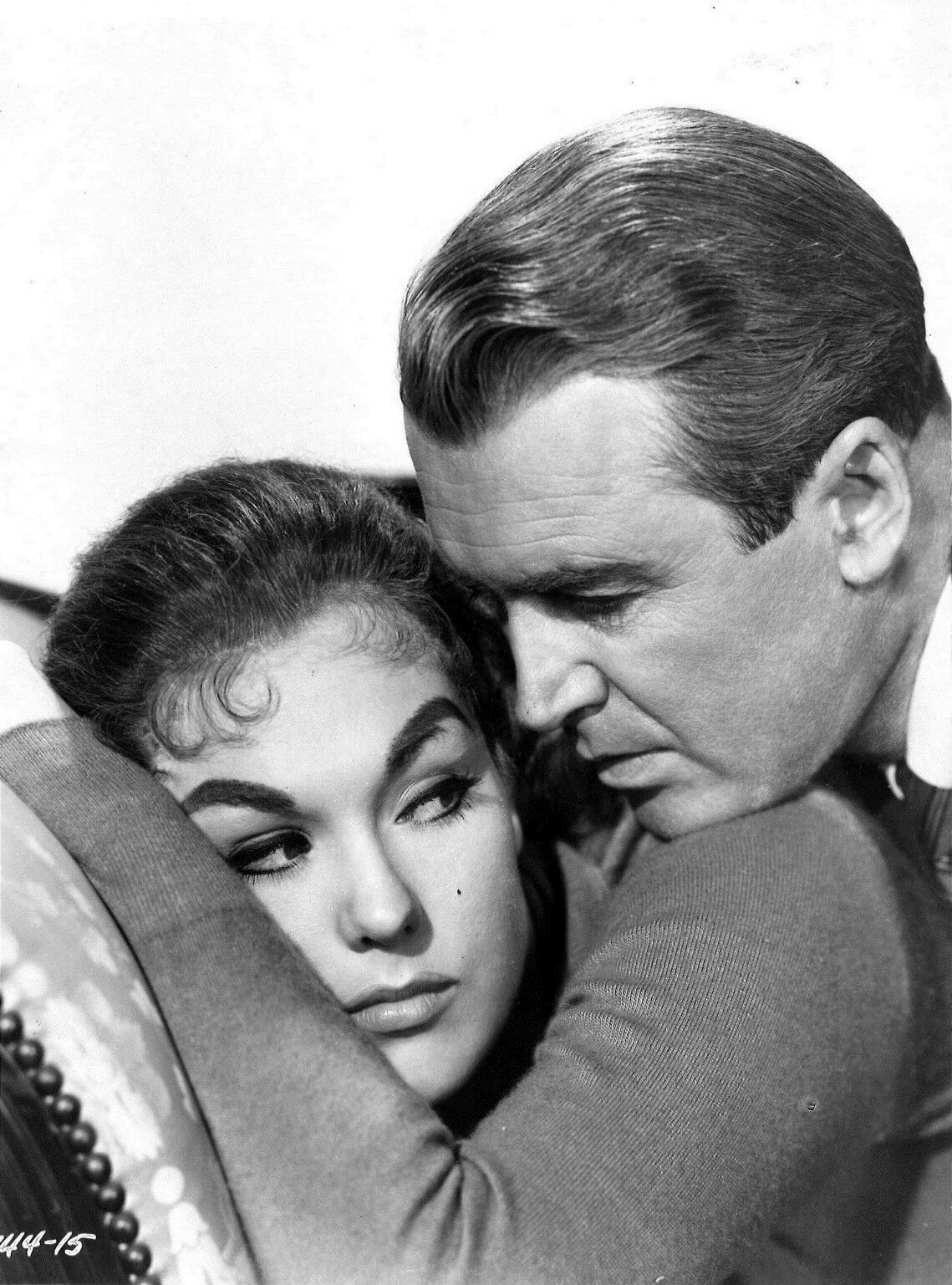 Kim Novak and James Stewart in a black-and-white publicity still for Alfred Hitchcock's Vertigo.