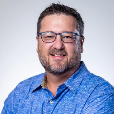 John Belamaric faces the camera in a GitHub profile portrait.