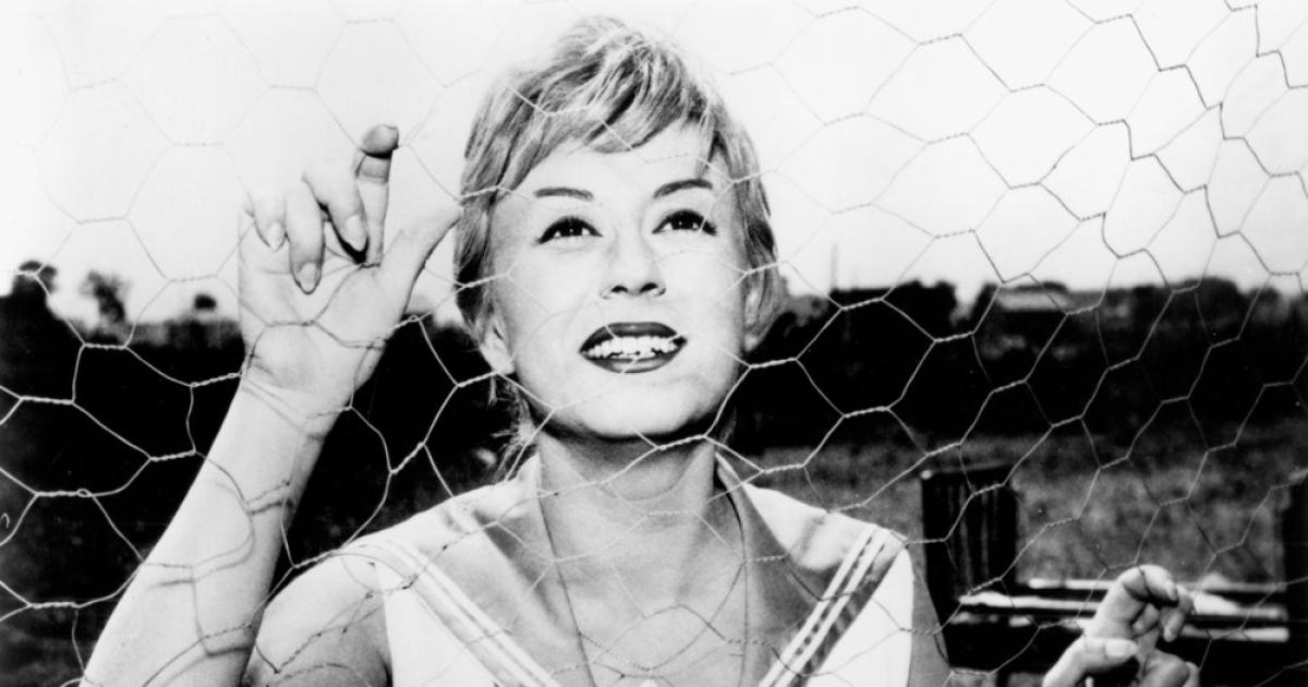 Giulietta Masina as Cabiria in a black-and-white still from Federico Fellini's 1957 film Nights of Cabiria.
