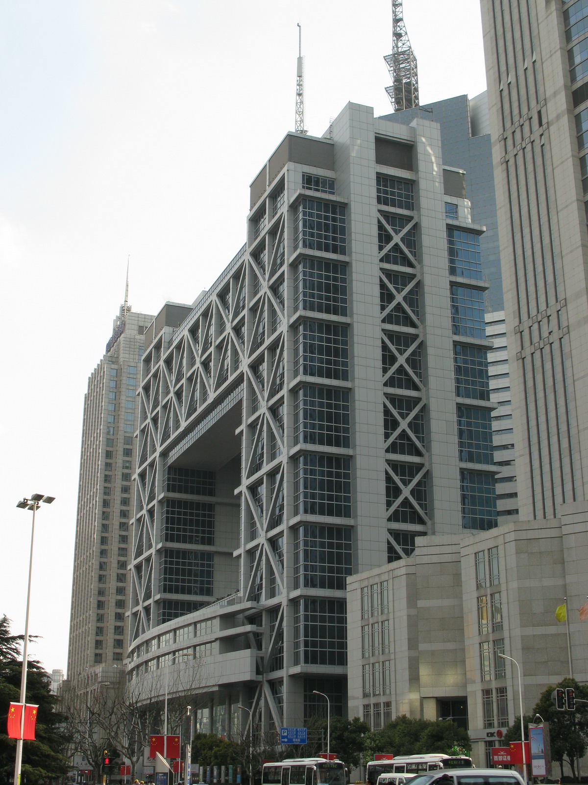A street-level photograph of the Shanghai Stock Exchange building.