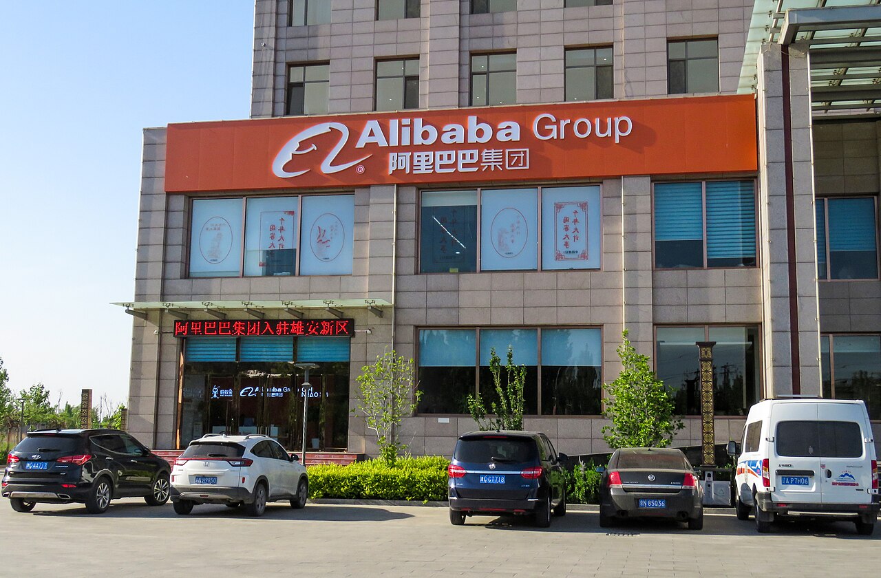 Alibaba Group provisional office signage in Xiong'an, photographed from the street.