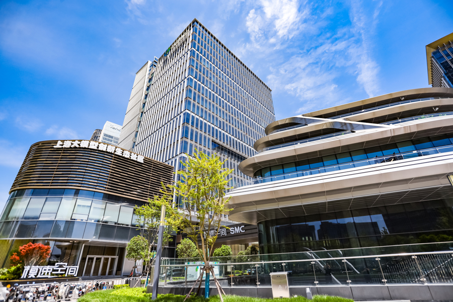 A daylight photograph of the Shanghai Foundation Model Innovation Center, with modern office buildings and signage visible at street level.