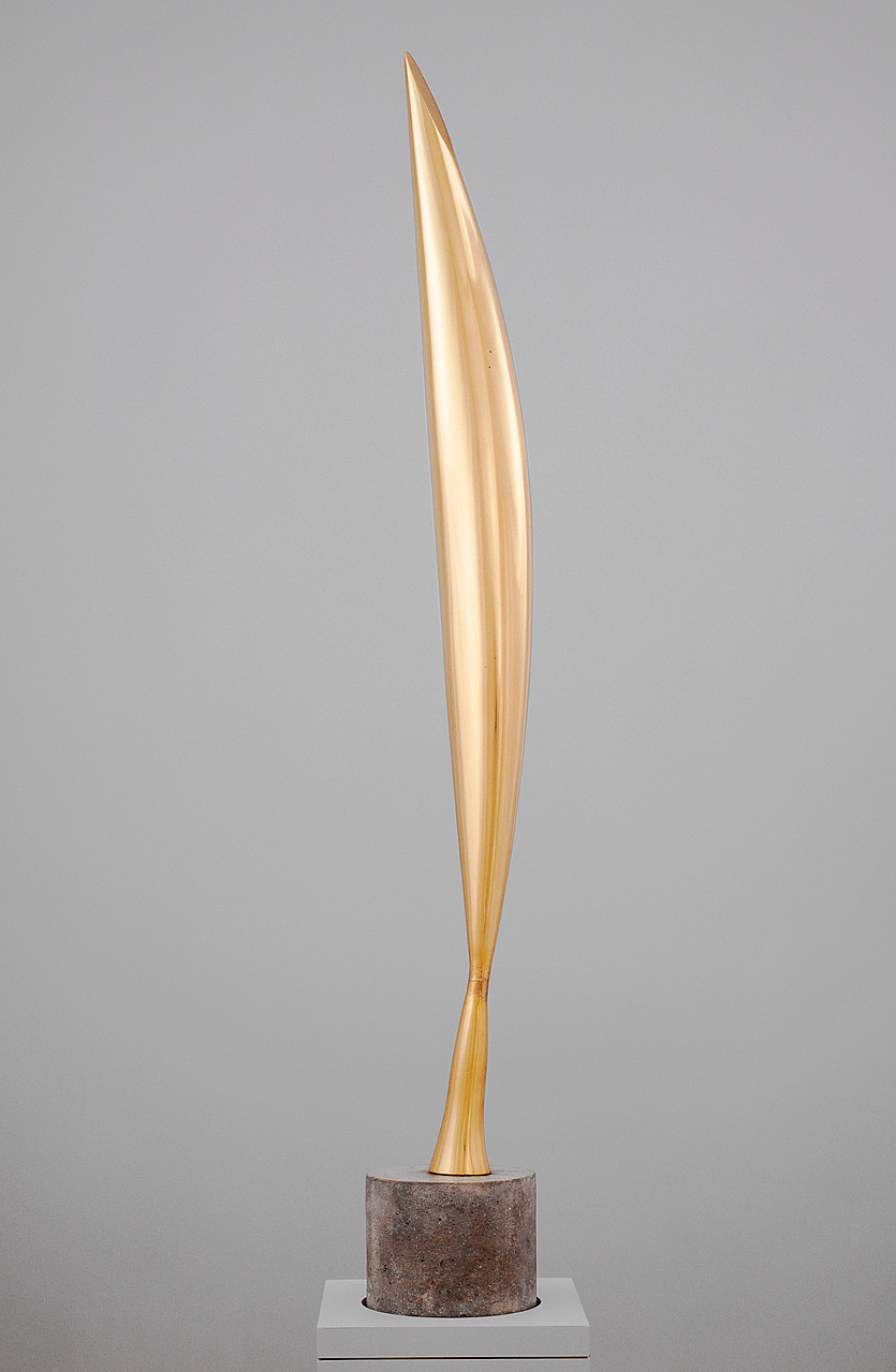 Constantin Brancusi's Bird in Space, a polished golden vertical sculpture rising from a cylindrical stone base against a neutral gray background.