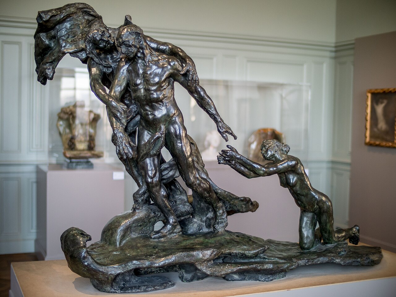 A bronze cast of Camille Claudel's The Age of Maturity at the Musee Rodin, showing an older woman pulling a man away from a kneeling imploring woman.