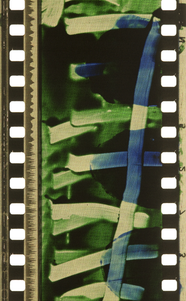 Photographed Dufaycolor frame from Len Lye's 1935 film A Colour Box, showing vivid abstract color bands and hand-painted shapes.