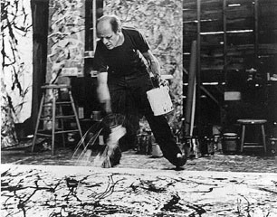 Hans Namuth's archival photograph of Jackson Pollock bending over a floor-laid canvas while applying paint in his studio.