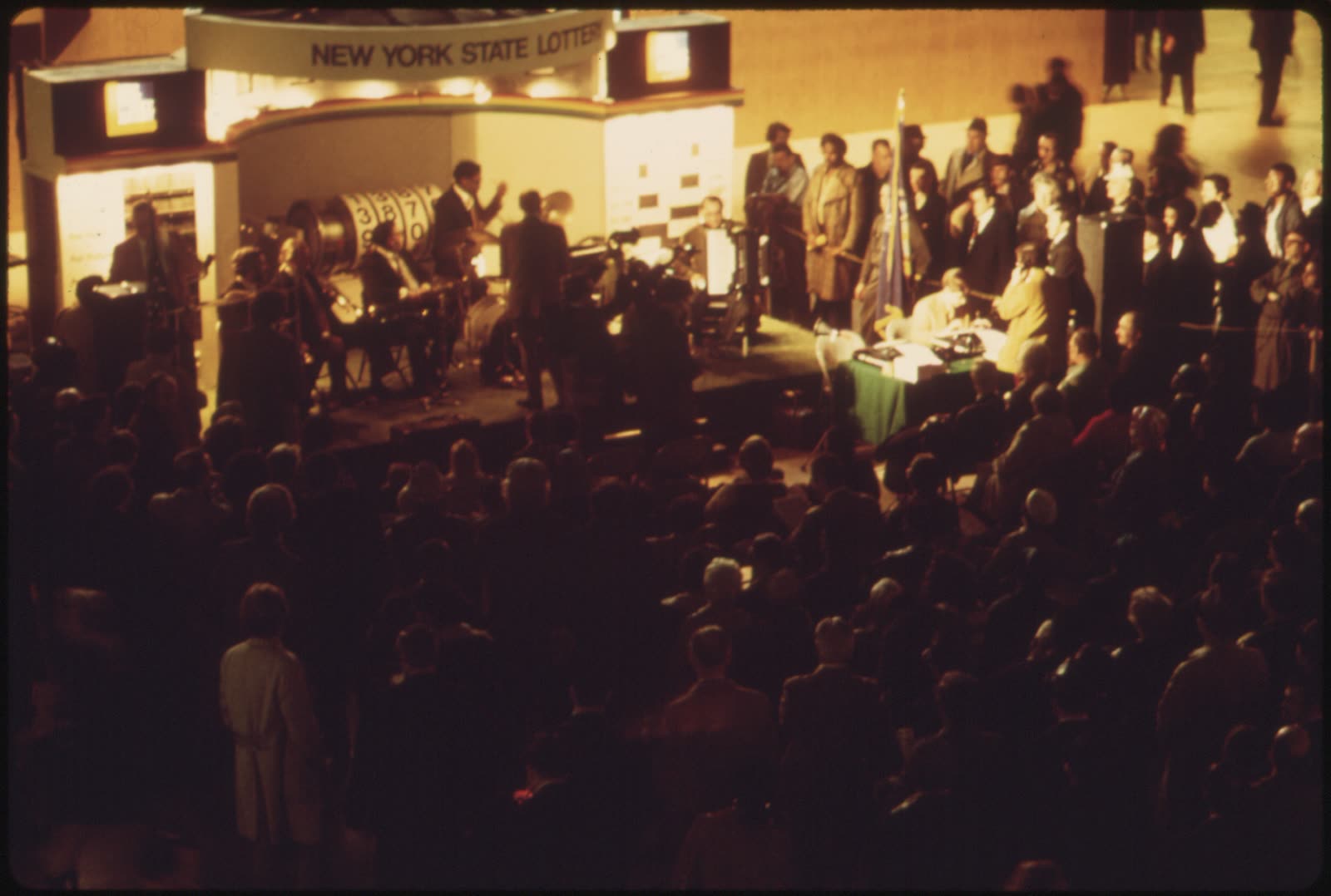 A 1974 crowd in New York City's Grand Central Station checks winners of the New York State Lottery.