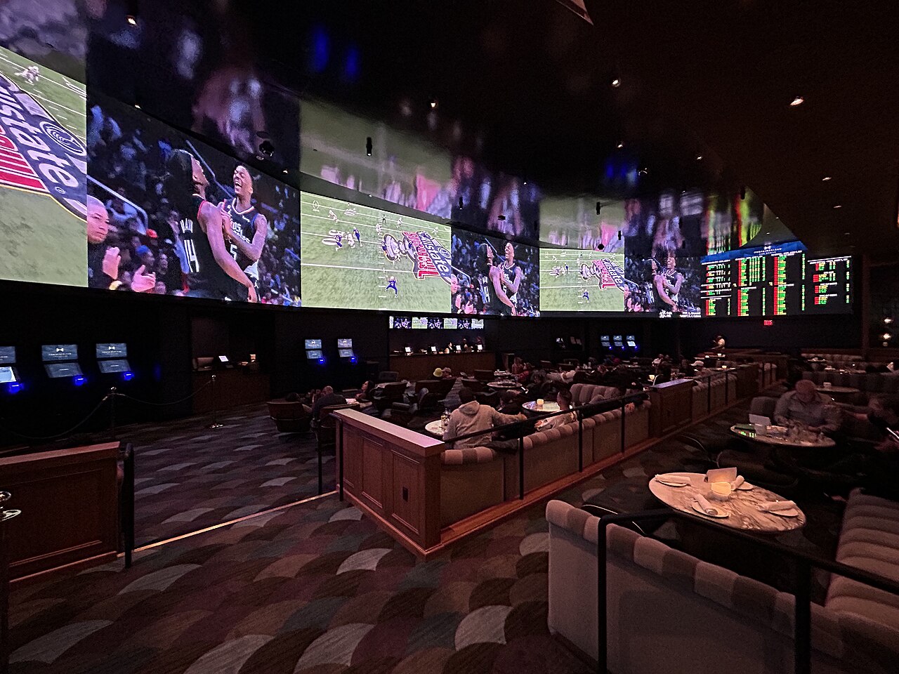 The sportsbook at Fontainebleau Las Vegas with seating, betting screens, and odds boards.