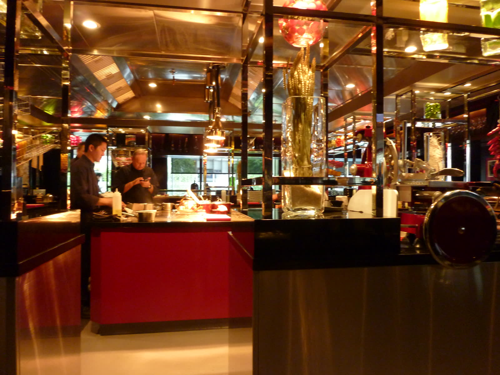 Joel Robuchon standing in the open kitchen of L'Atelier de Joel Robuchon in Hong Kong before lunch service.