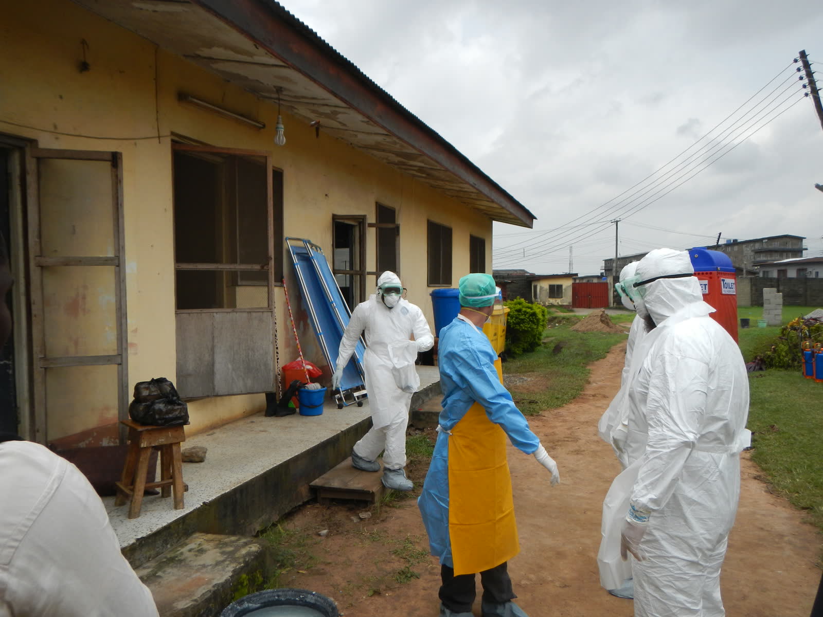 World Health Organization workers wearing personal protective equipment before entering an Ebola isolation ward in Lagos, Nigeria.