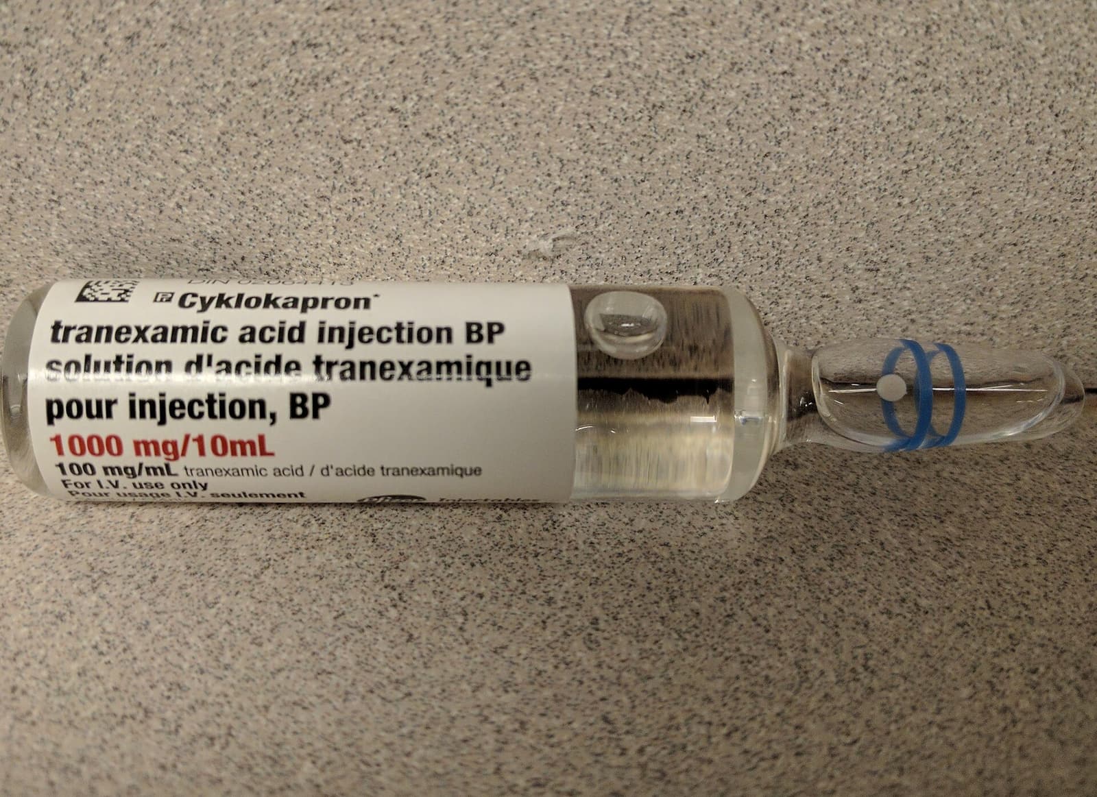 Photograph of a vial of tranexamic acid for intravenous use.