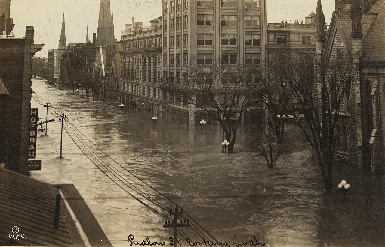 Archival black-and-white photograph of floodwater covering Ludlow Street in Dayton, Ohio, during the 1913 flood.