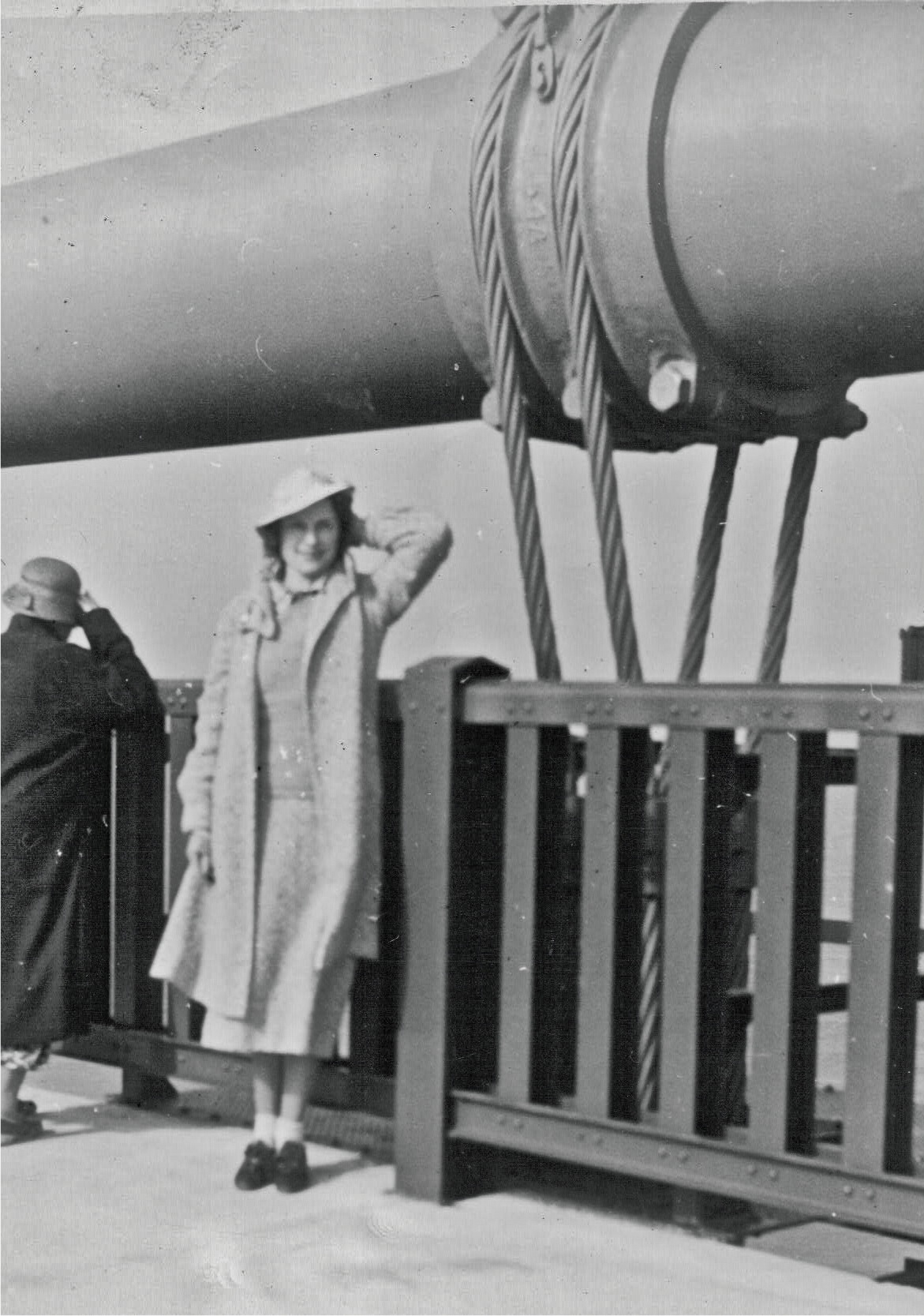 Archival photograph of Annell Euler standing by the Golden Gate Bridge railing during the 1937 opening period.
