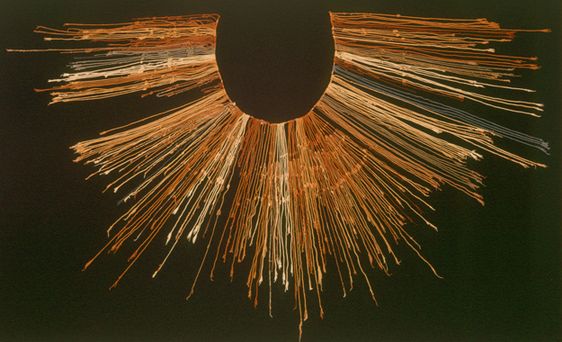 Photograph of an Inka quipu from the Larco Museum in Lima, with pendant cords and knots hanging from a primary cord.