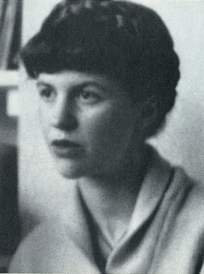 Black-and-white photographic portrait of Sylvia Plath sitting sideways to the camera.