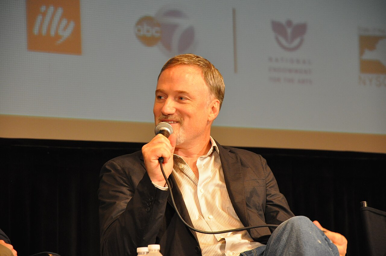 David Fincher stands beside Jesse Eisenberg at the New York Film Festival premiere of The Social Network in 2010.
