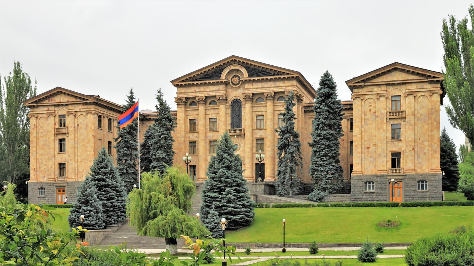 The National Assembly building of Armenia in Yerevan seen from the street on a sunny day.