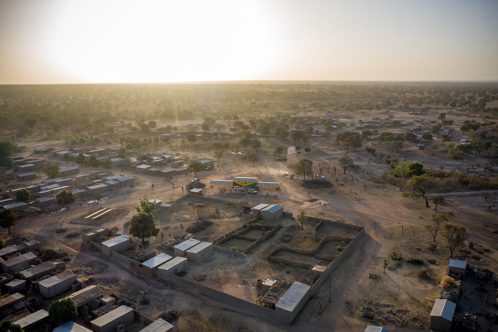 A solar container system stands in the rural village of Foh in Mali at sunset.