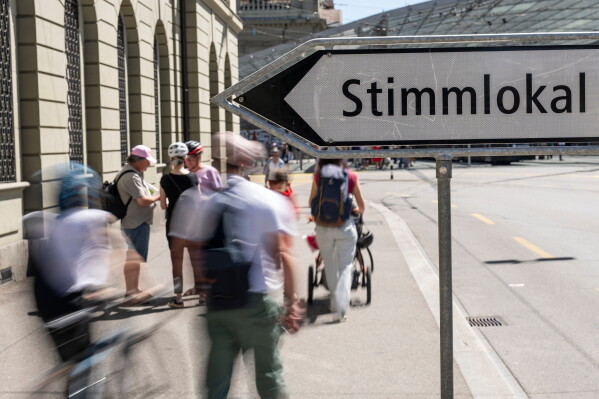 People walk toward a polling station in Bern during Switzerland's June 14, 2026 vote.