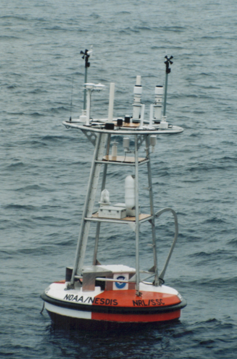 A NOAA ocean instrumentation buoy floats in open water during a 1998 Pacific deployment cruise.