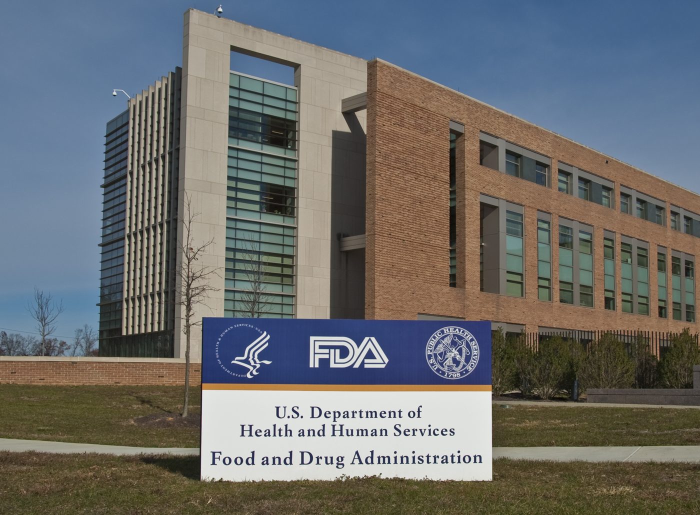 Photograph of the FDA White Oak campus entrance sign with Building 21 behind it.