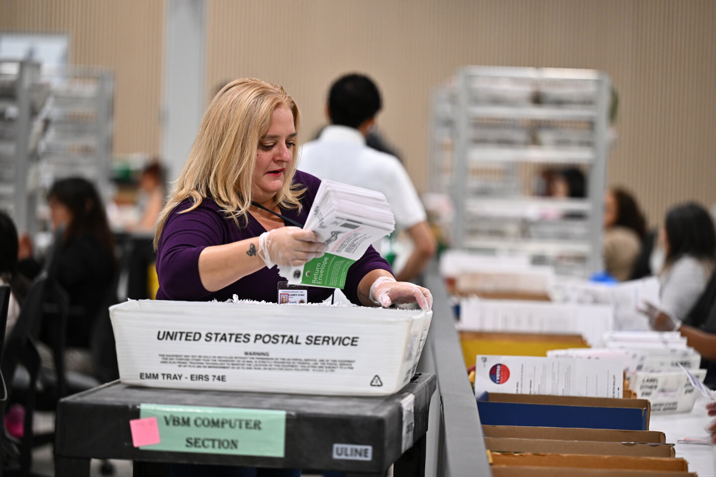 Ballots are counted at the L.A. County Ballot Processing Center during the California primary election in City of Industry, California.