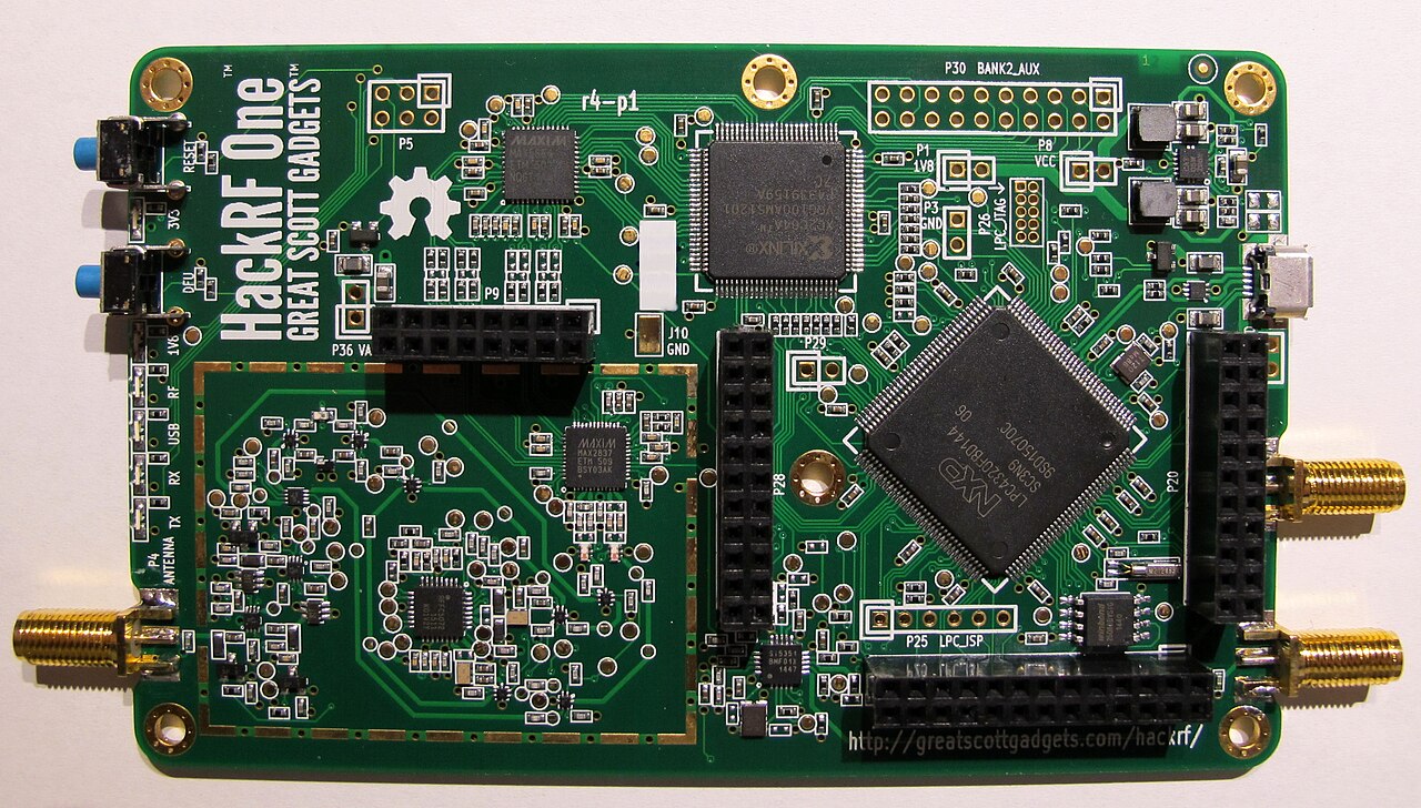 A close photograph of a HackRF One software-defined radio circuit board, showing RF and USB hardware on the board.