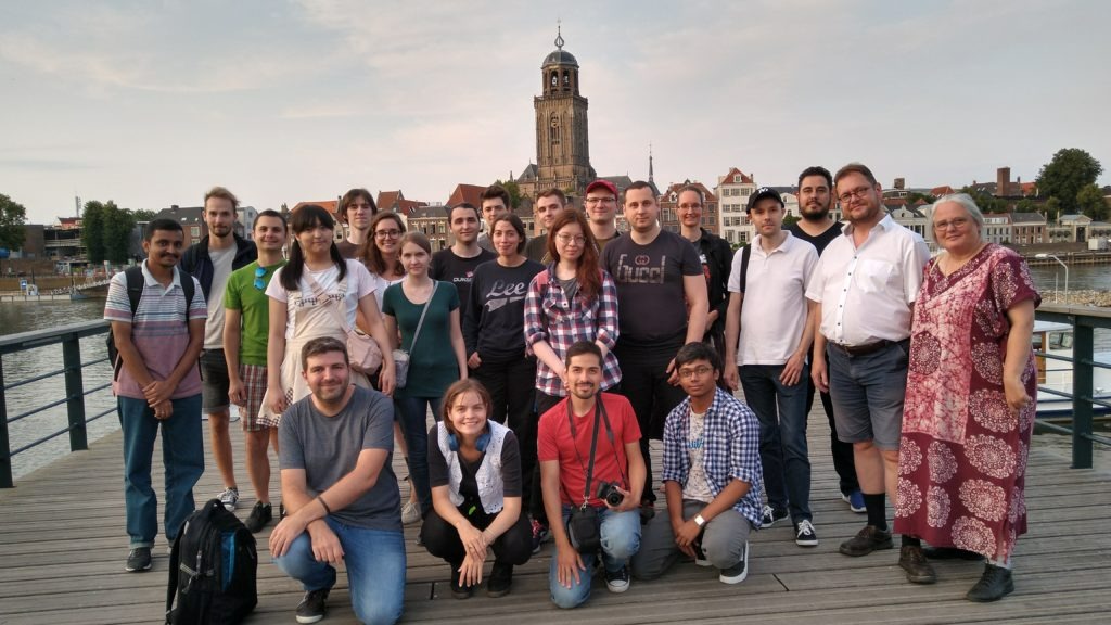 Krita developers, artists, and contributors standing together on a riverside walkway in Deventer during the 2019 Krita sprint.