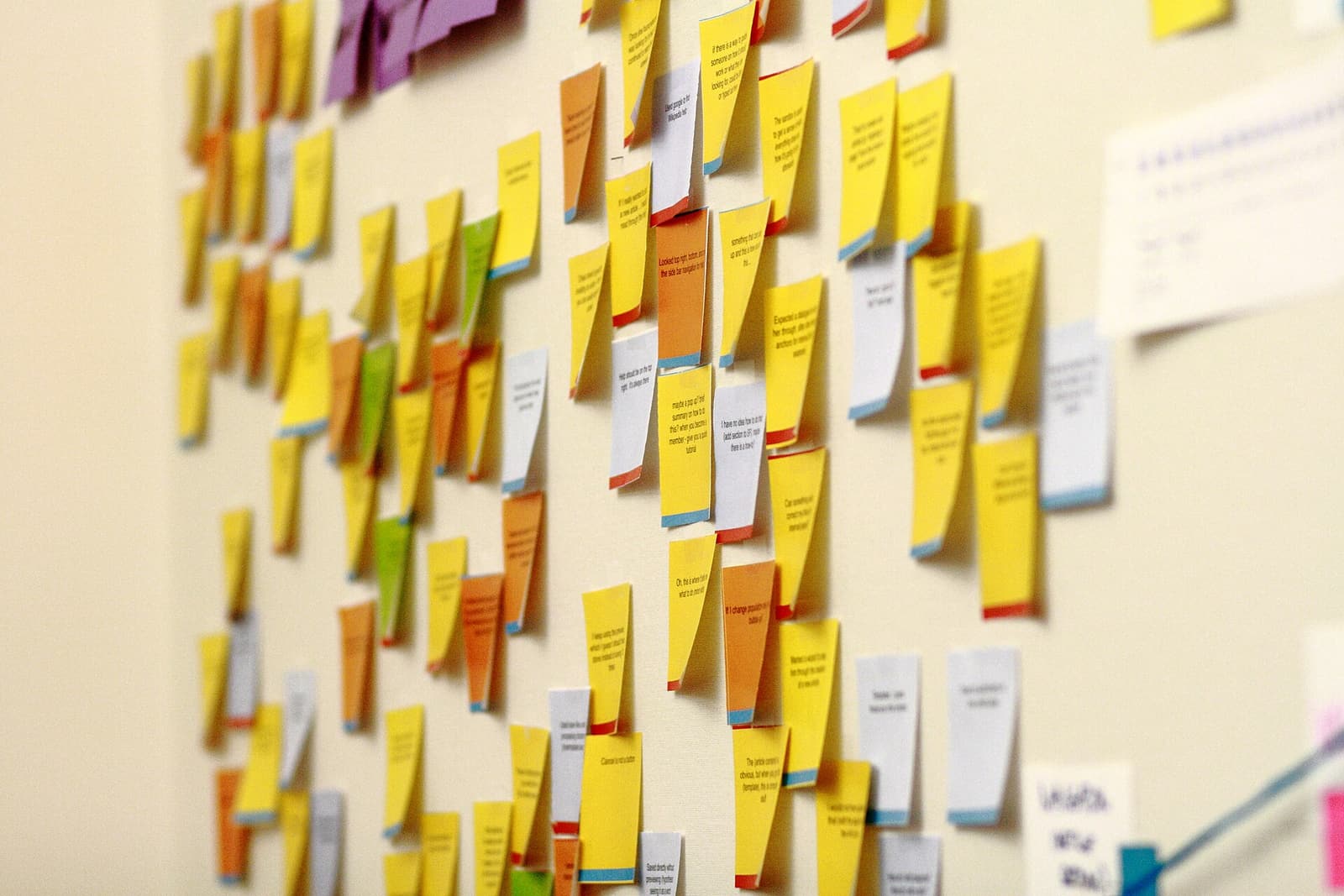 Colorful sticky notes arranged on a wall in the Wikimedia Foundation office.