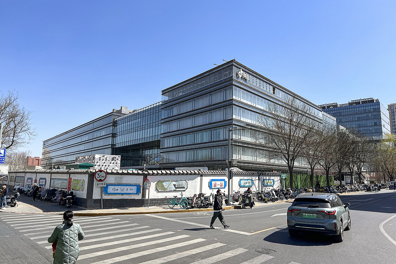 A ByteDance-operated office complex at Dazhongsi Plaza in Beijing, seen across a street beneath a clear blue sky.