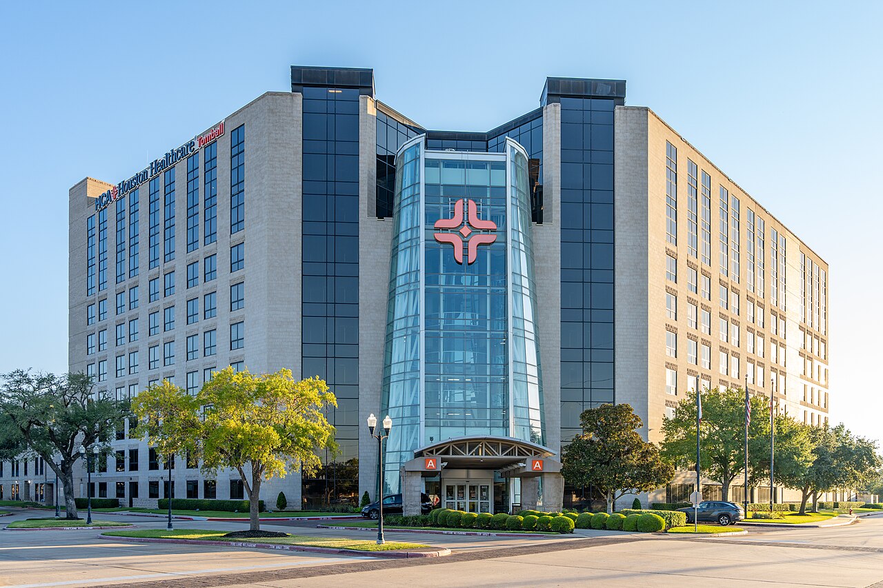 The exterior entrance and glass atrium of HCA Houston Healthcare Tomball in Texas.