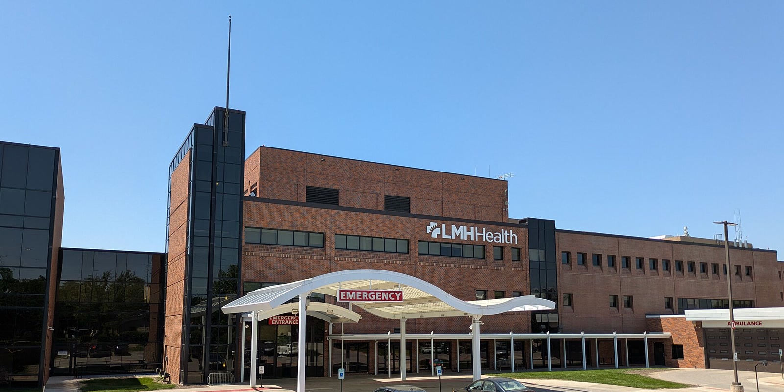 Daytime photograph of the emergency entrance and ambulance bay at Lawrence Memorial Hospital in Kansas.