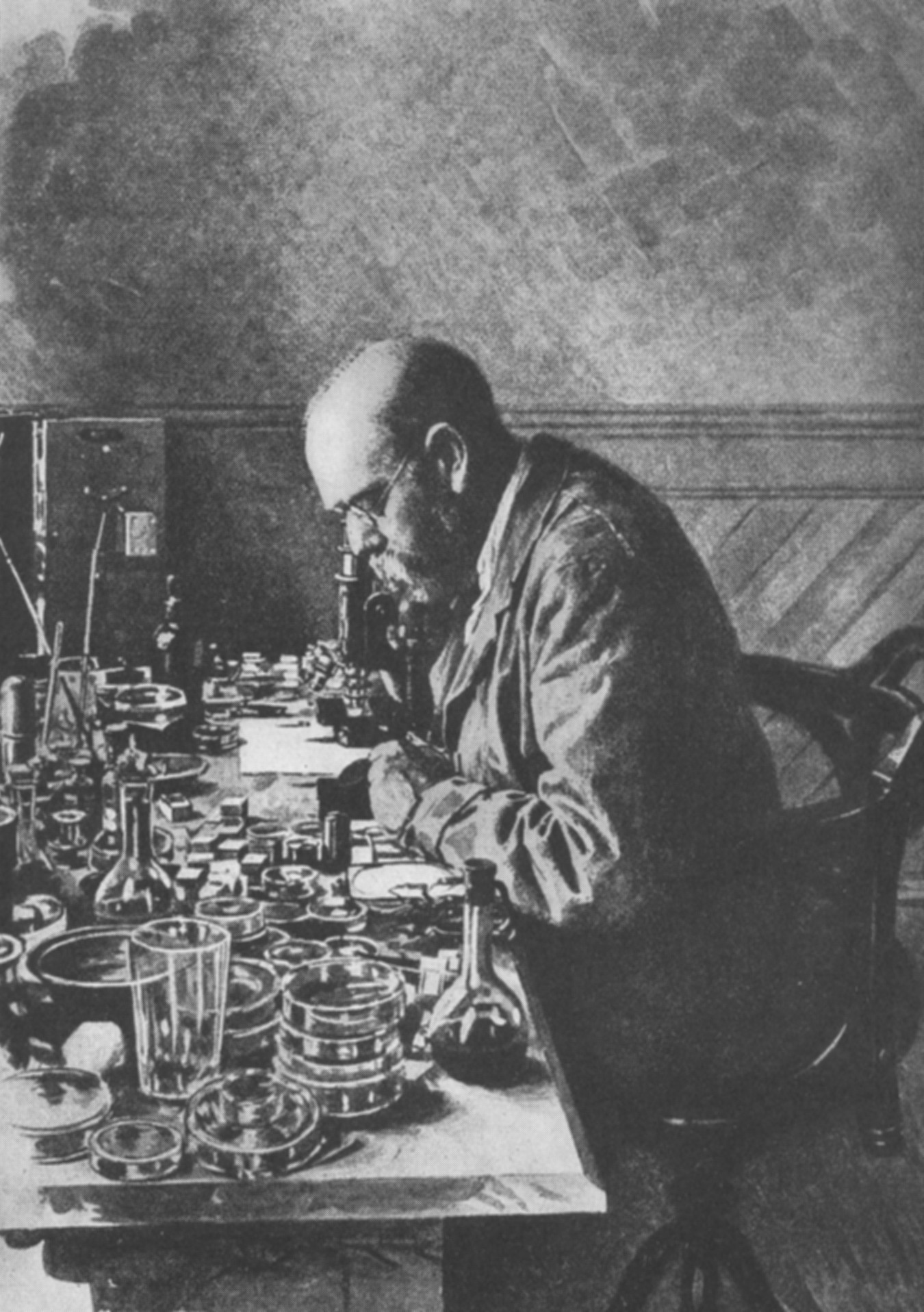 Robert Koch 在实验室显微镜前工作的黑白档案照片。