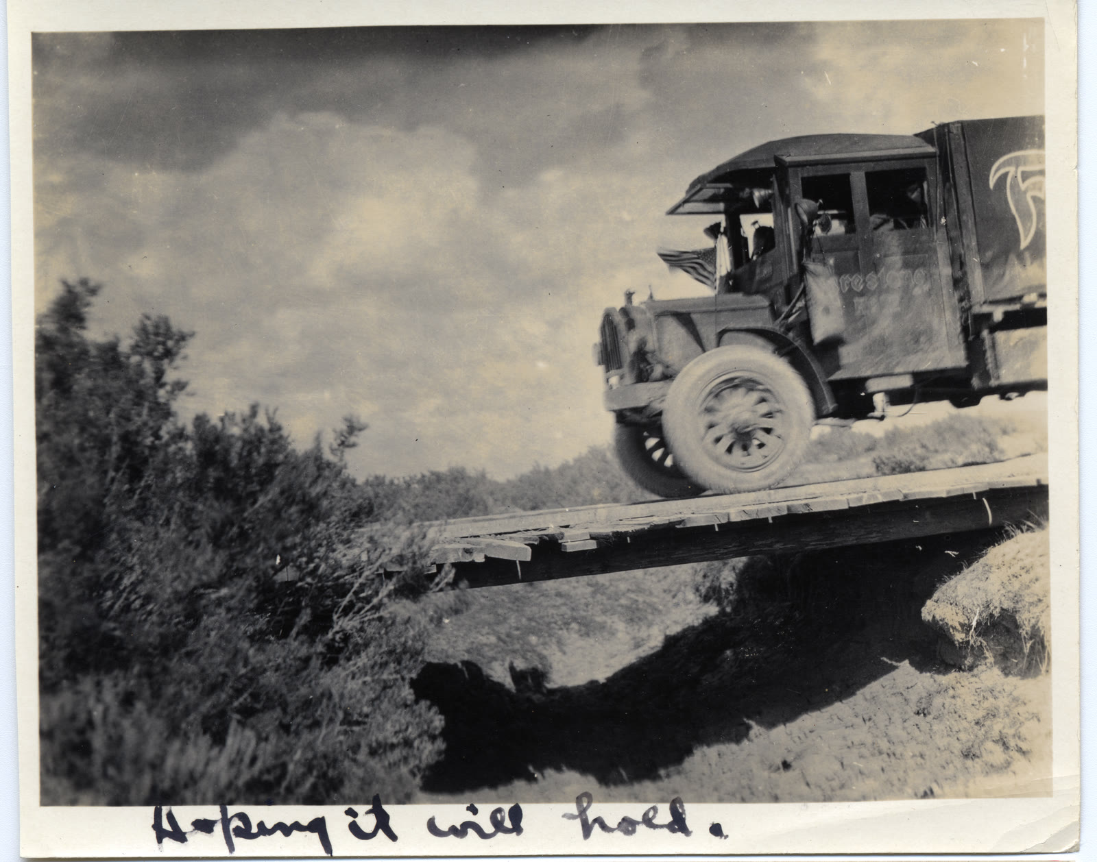An Army truck crosses a narrow wooden bridge during the 1919 transcontinental motor convoy.