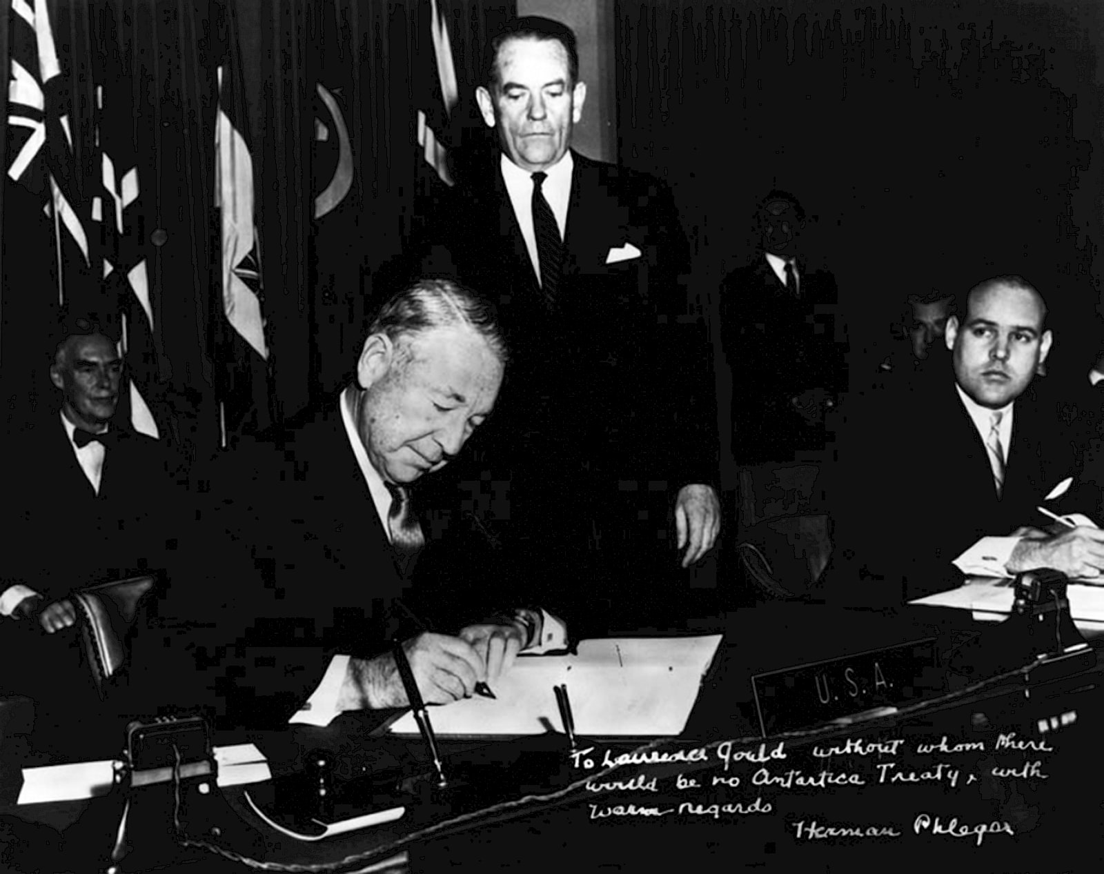Archival black-and-white photograph of United States representative Herman Phleger signing the Antarctic Treaty in December 1959.