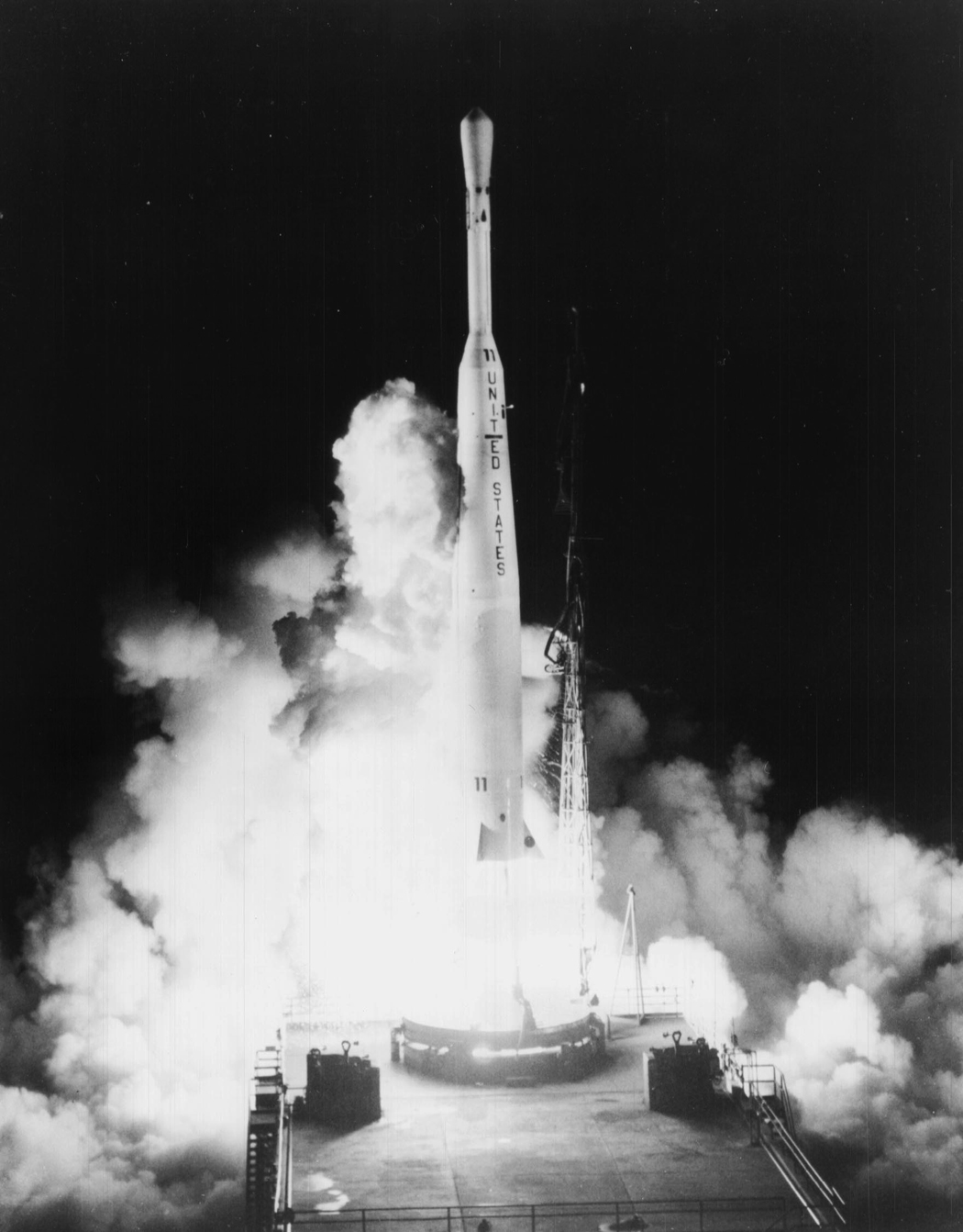 Black-and-white NASA archival photograph of the Thor-Delta rocket launching Telstar 1 from Cape Canaveral at night on July 10, 1962.