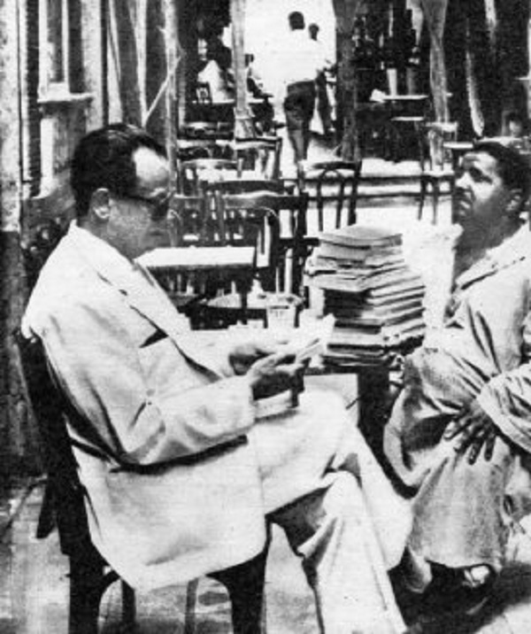 Archival 1968 photograph of Naguib Mahfouz seated in a cafe.