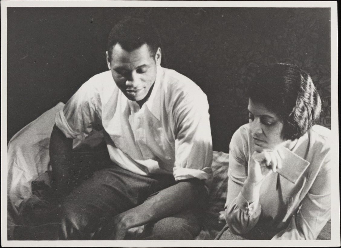 Paul and Eslanda Robeson as Pete and Adah sit side by side in a black-and-white still from Borderline.