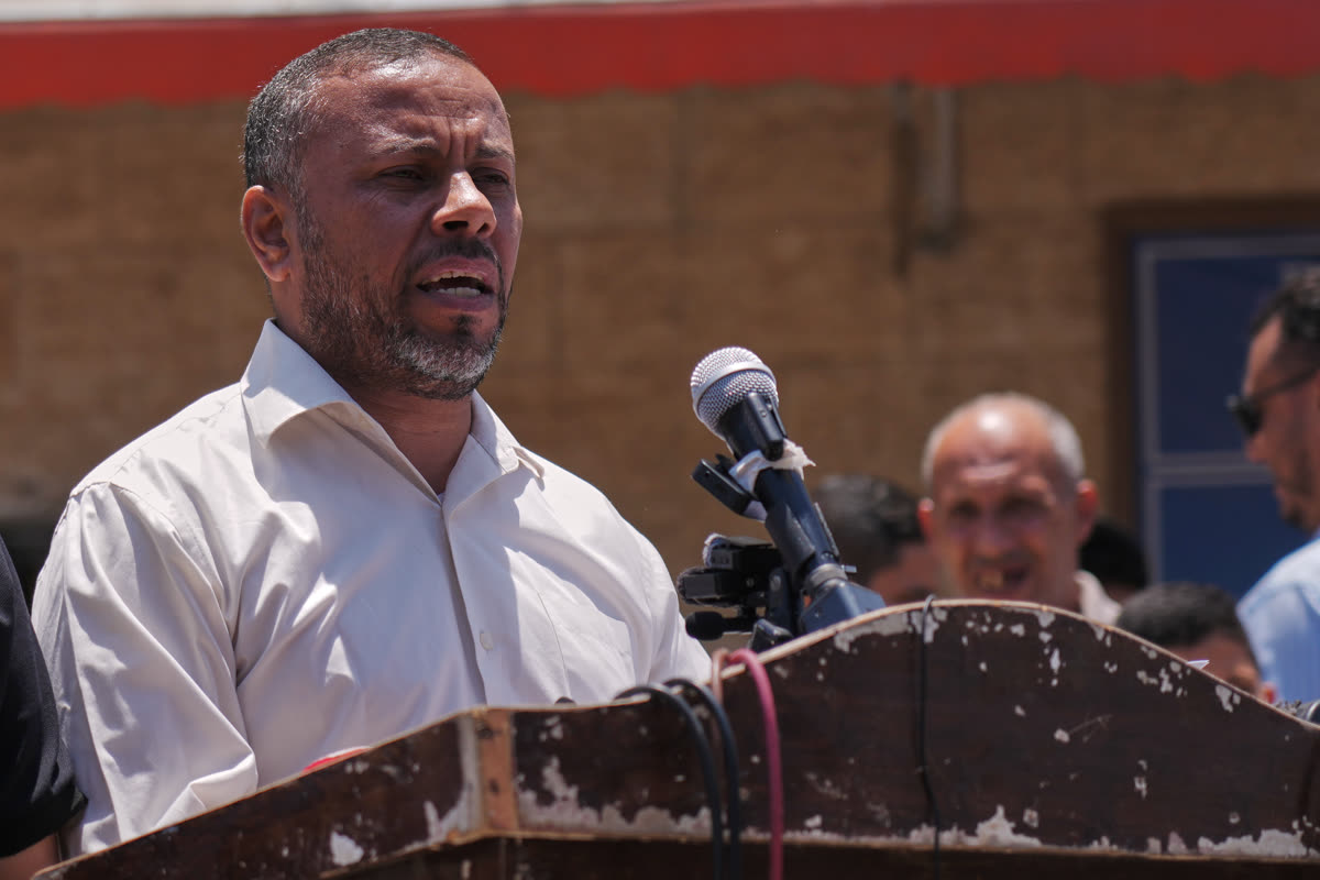 Ismail al-Thawabta speaks at a microphone during a press conference at Al-Aqsa Hospital in Deir al-Balah, central Gaza Strip.