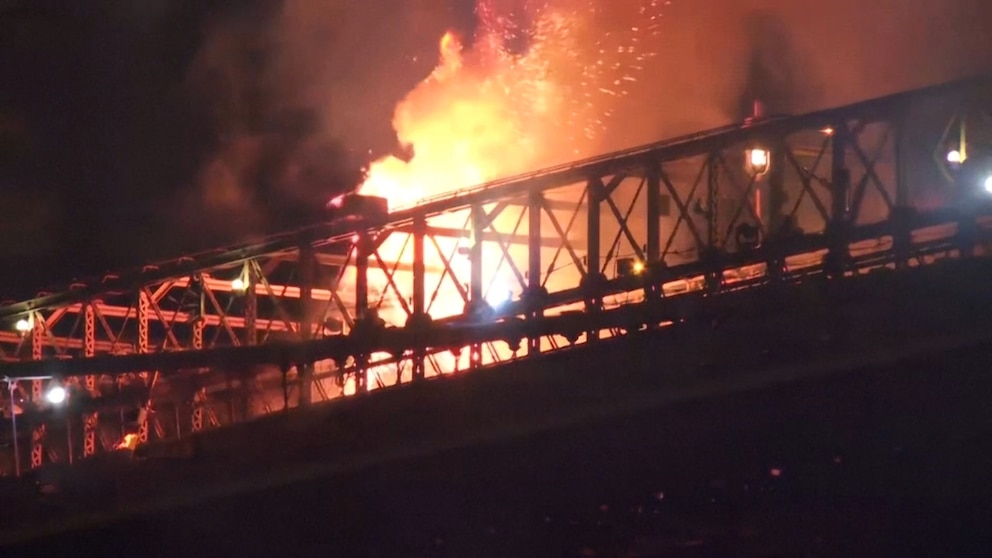 Flames and smoke rise from a section of the Brooklyn Bridge during New York City's July Fourth fireworks celebration on July 4, 2026.