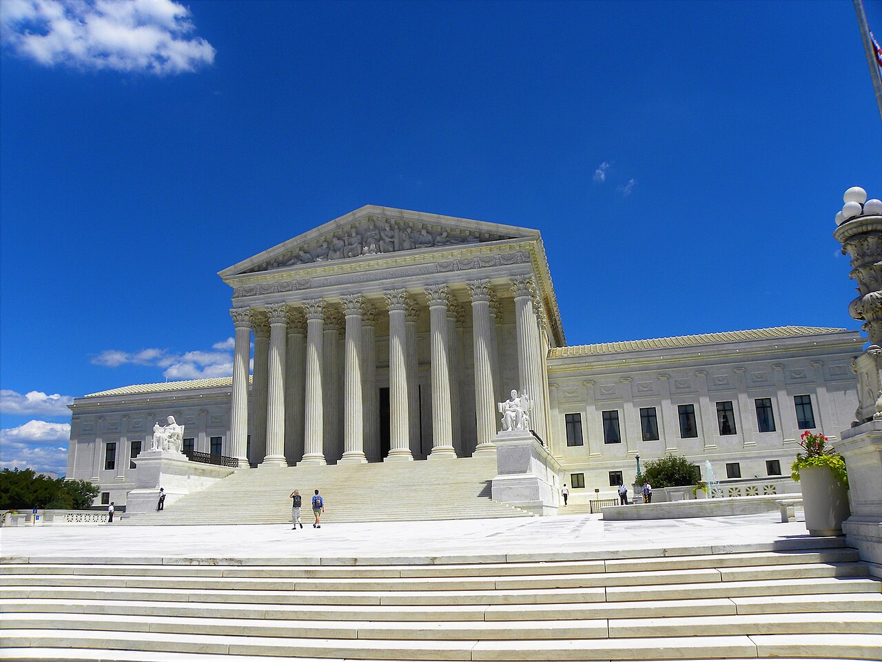 Front steps and columns of the United States Supreme Court Building in Washington, D.C., photographed in daylight.