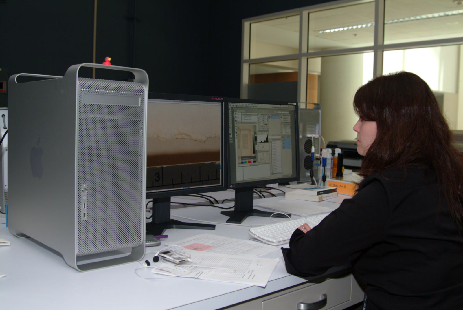 A technician reviews a high-resolution document image on two monitors in the U.S. National Archives Digital Imaging Lab at Archives II.