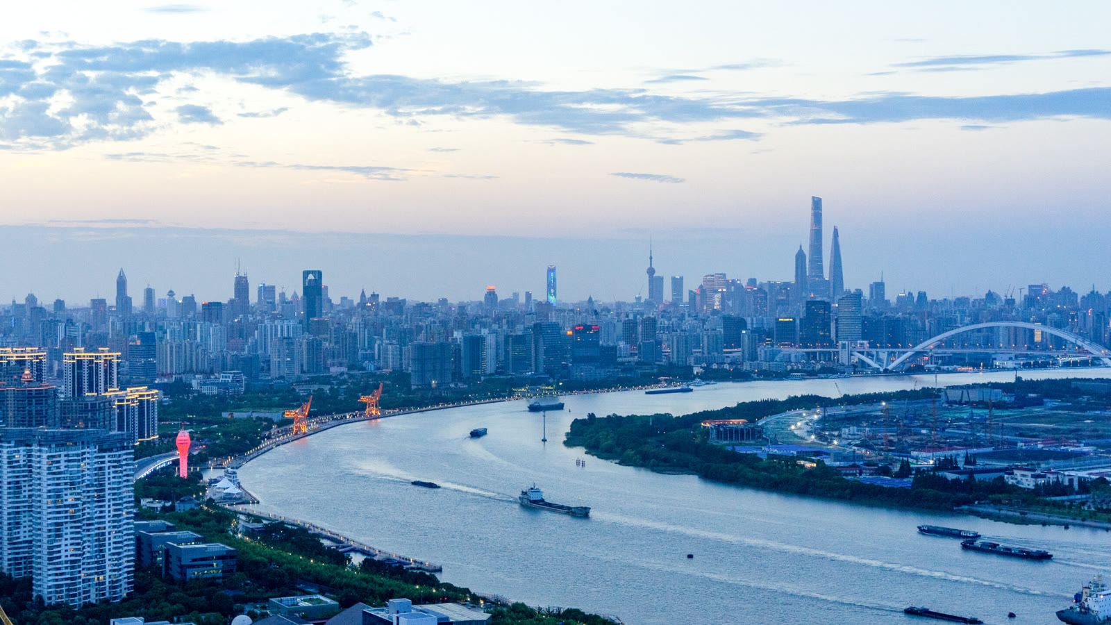 An evening view from Microsoft Research Asia's Shanghai lab across the Huangpu River toward the city's skyline.