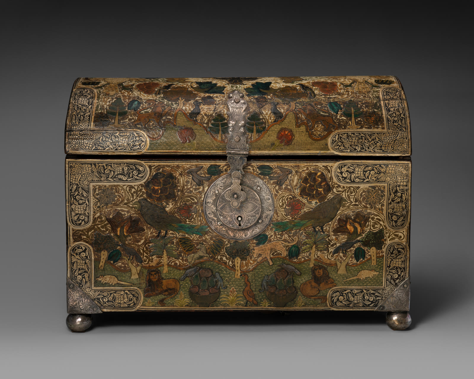 An early eighteenth-century Colombian wooden chest covered with glossy red, gold, green, and black barniz de Pasto patterns of birds, animals, flowers, and scrollwork.